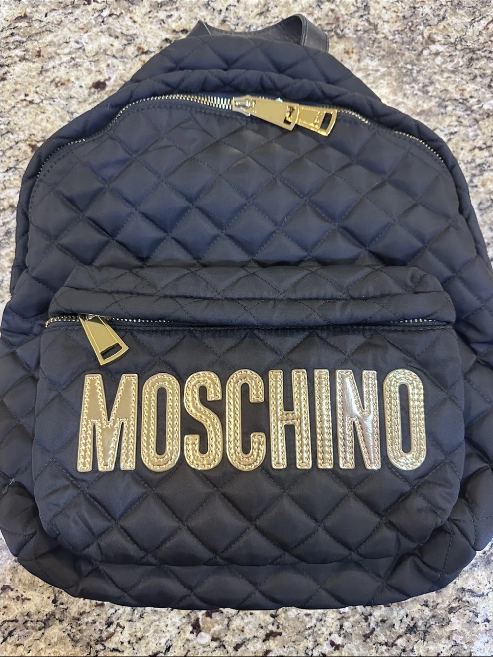 Moschino Black Quilted Backpack with Gold Hardware Accent